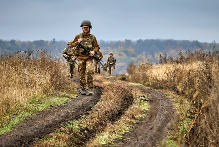 Members of the Hartia brigade train before arriving at the front PHOTO EPA-EFE