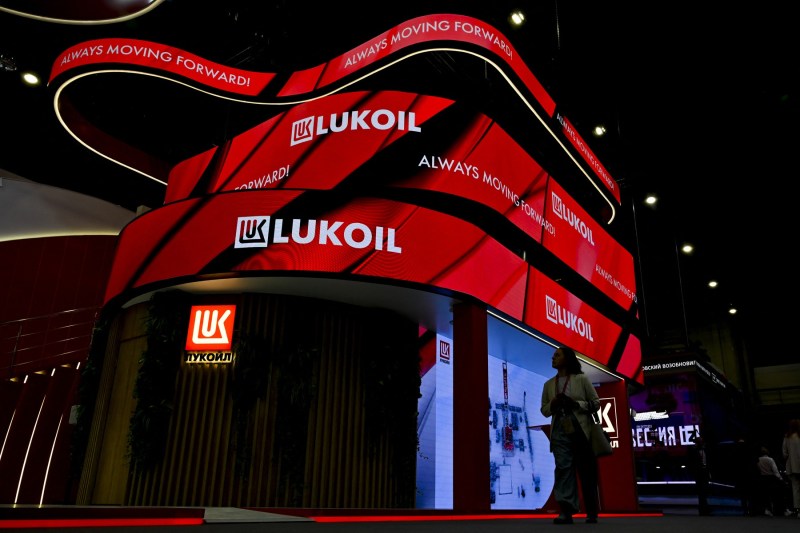 Who is the company that wants to buy Lukoil assets. What bribery charges did he face?