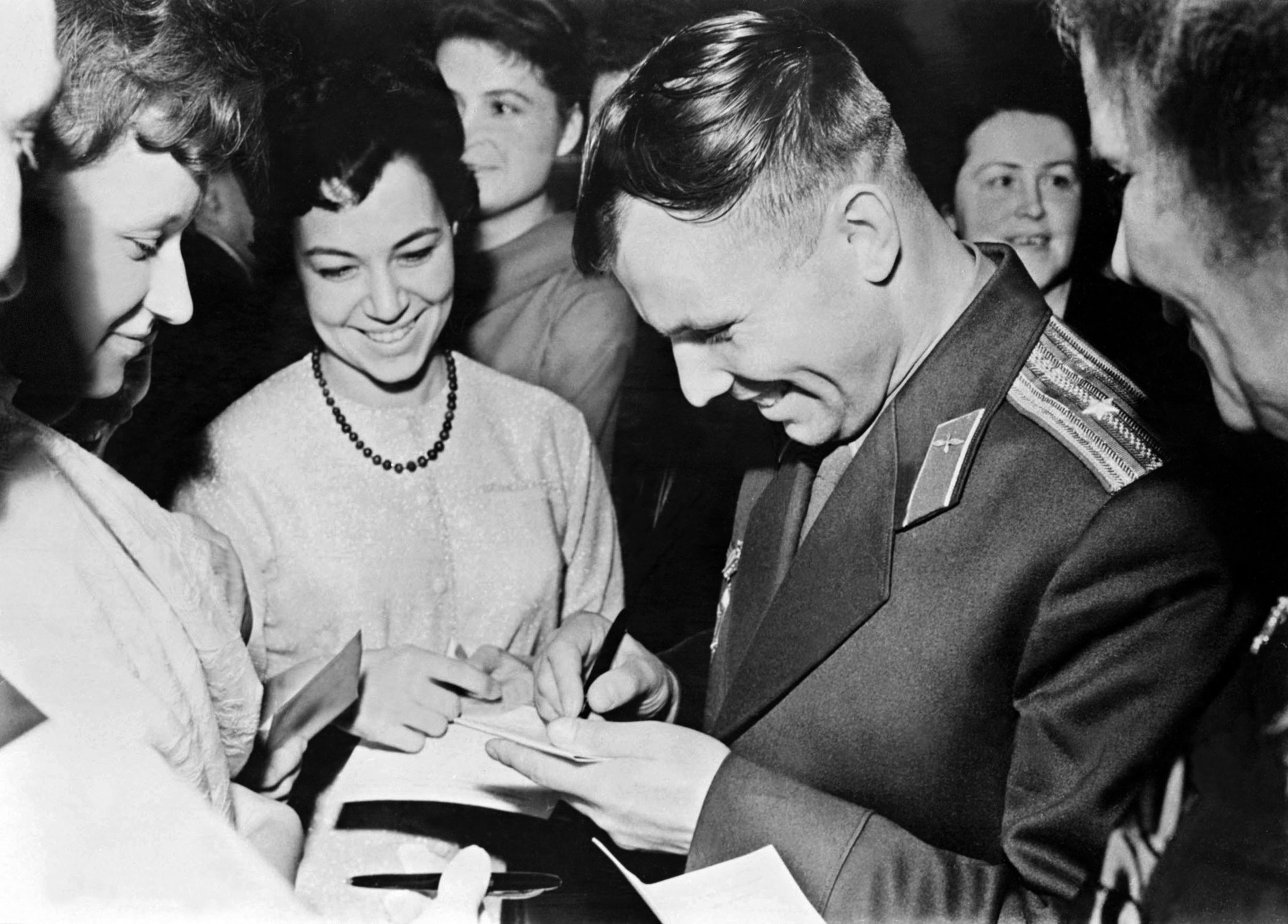 Yuri Gagarin signing autographs (1961)
