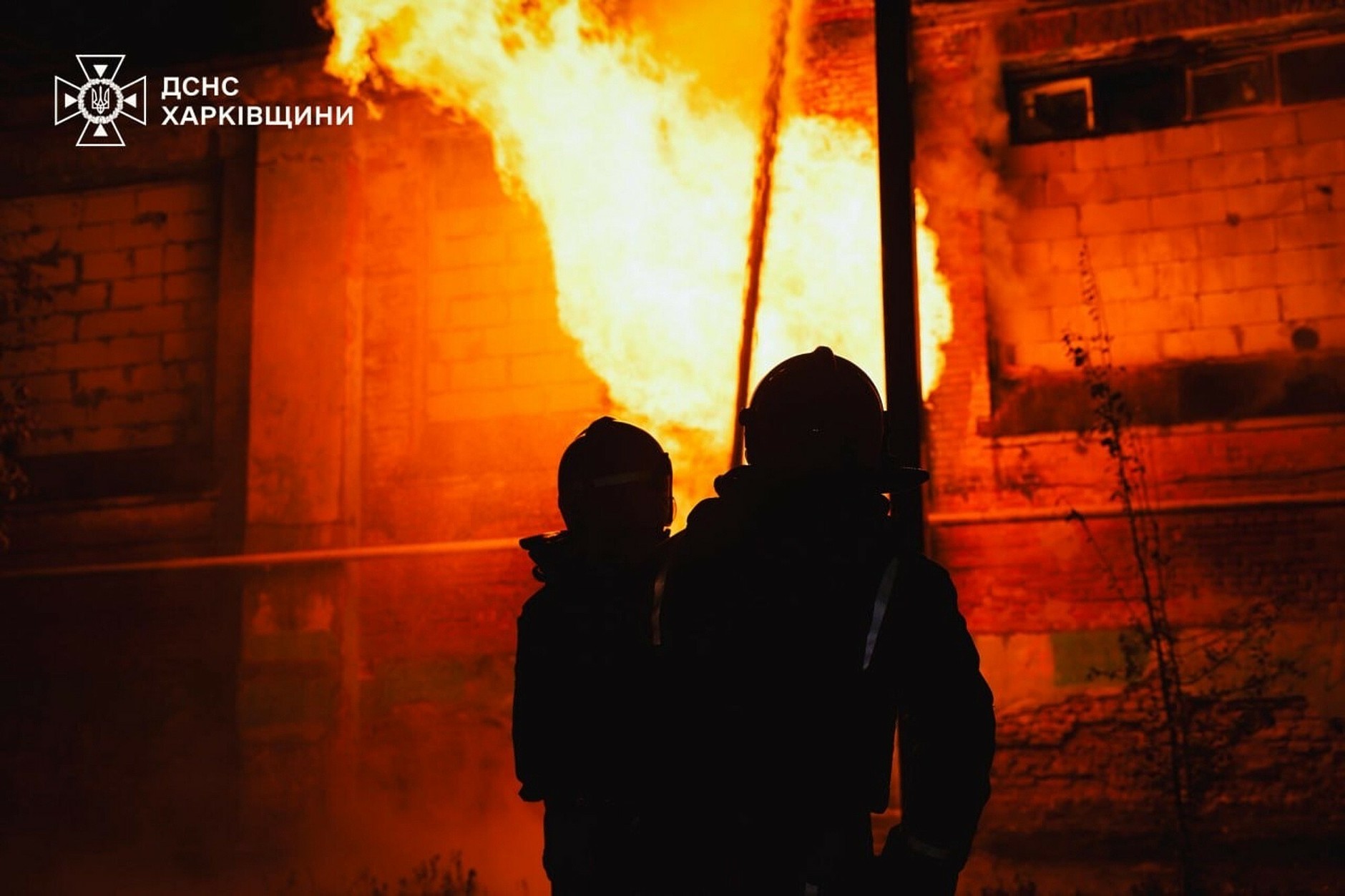 In this photo shared by Ukrainian rescue services, a firefighter carries a child out of a hospital damaged by a Russian attack in Kharkiv, October 14, 2025.