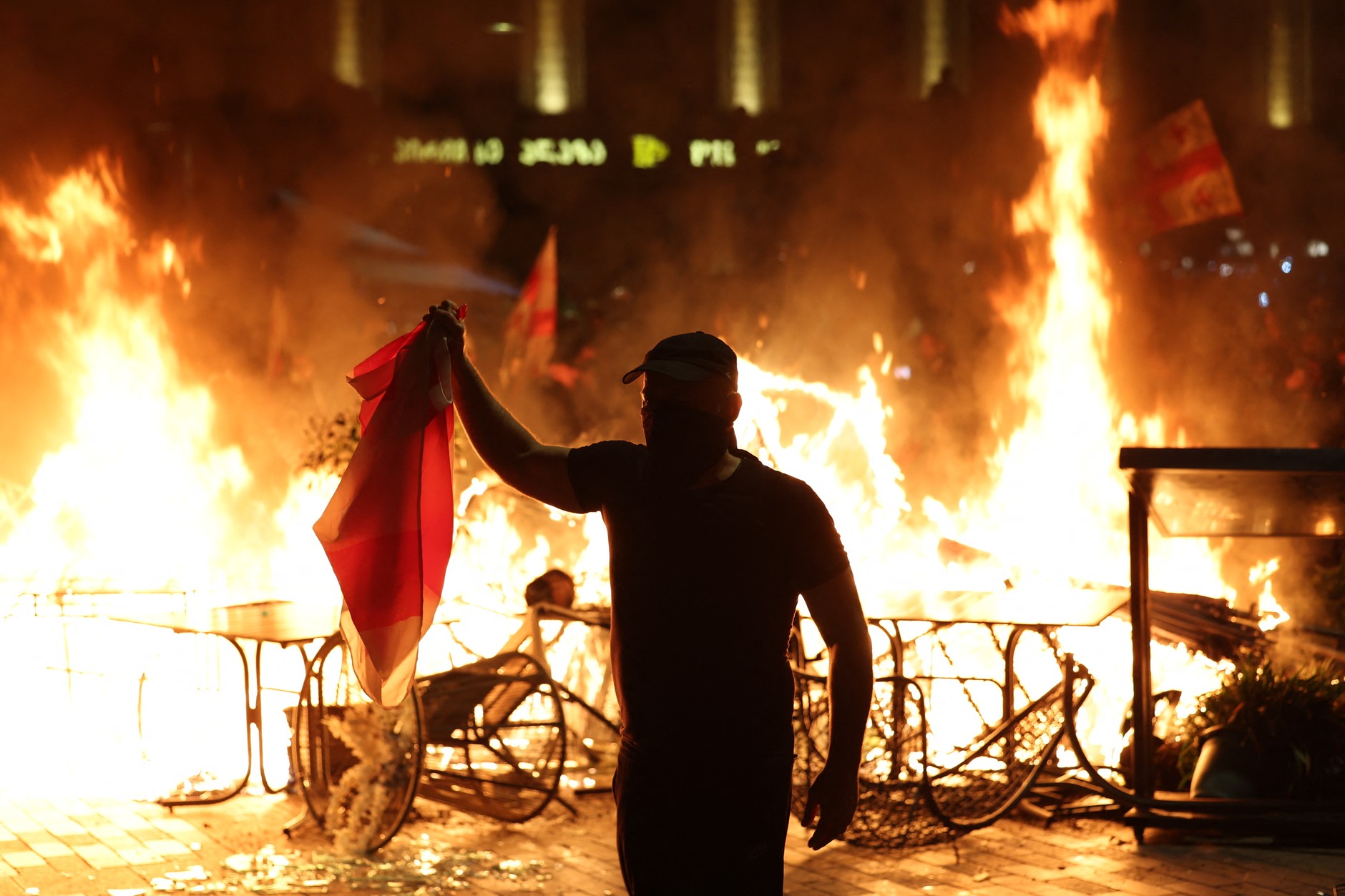 Protesters smoke barricades during the opposition rally on the day of local elections in the center of Tbilisi on October 4, 2025.