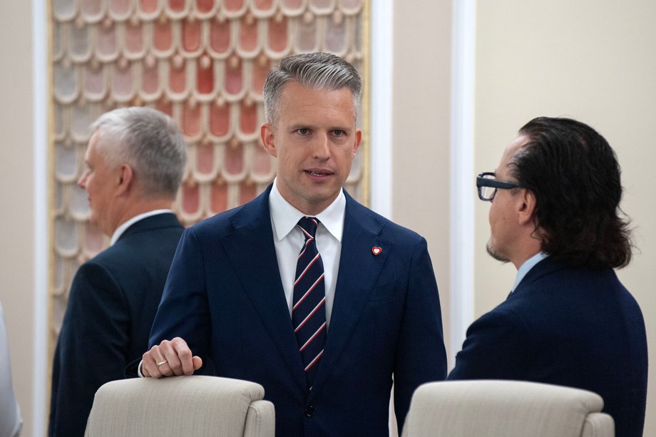 Deputy Minister of Infrastructure Arkadiusz Marchewka talks to Minister of State Assets Wojciech Balczun before the government meeting