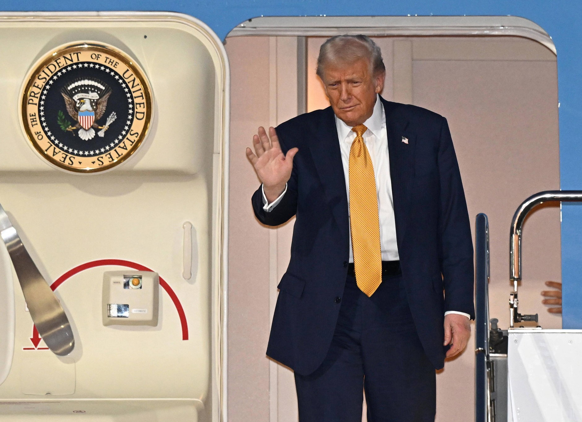 U.S. President Donald Trump disembarks from Air Force One after arriving at Haneda International Airport in Tokyo, Japan, October 27, 2025.