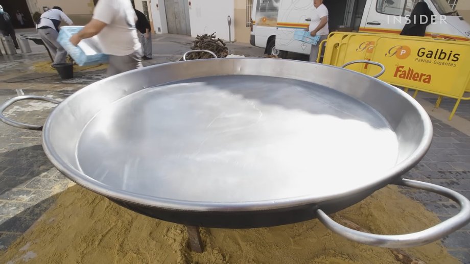 The giant paella is cooked in a pan over two meters long