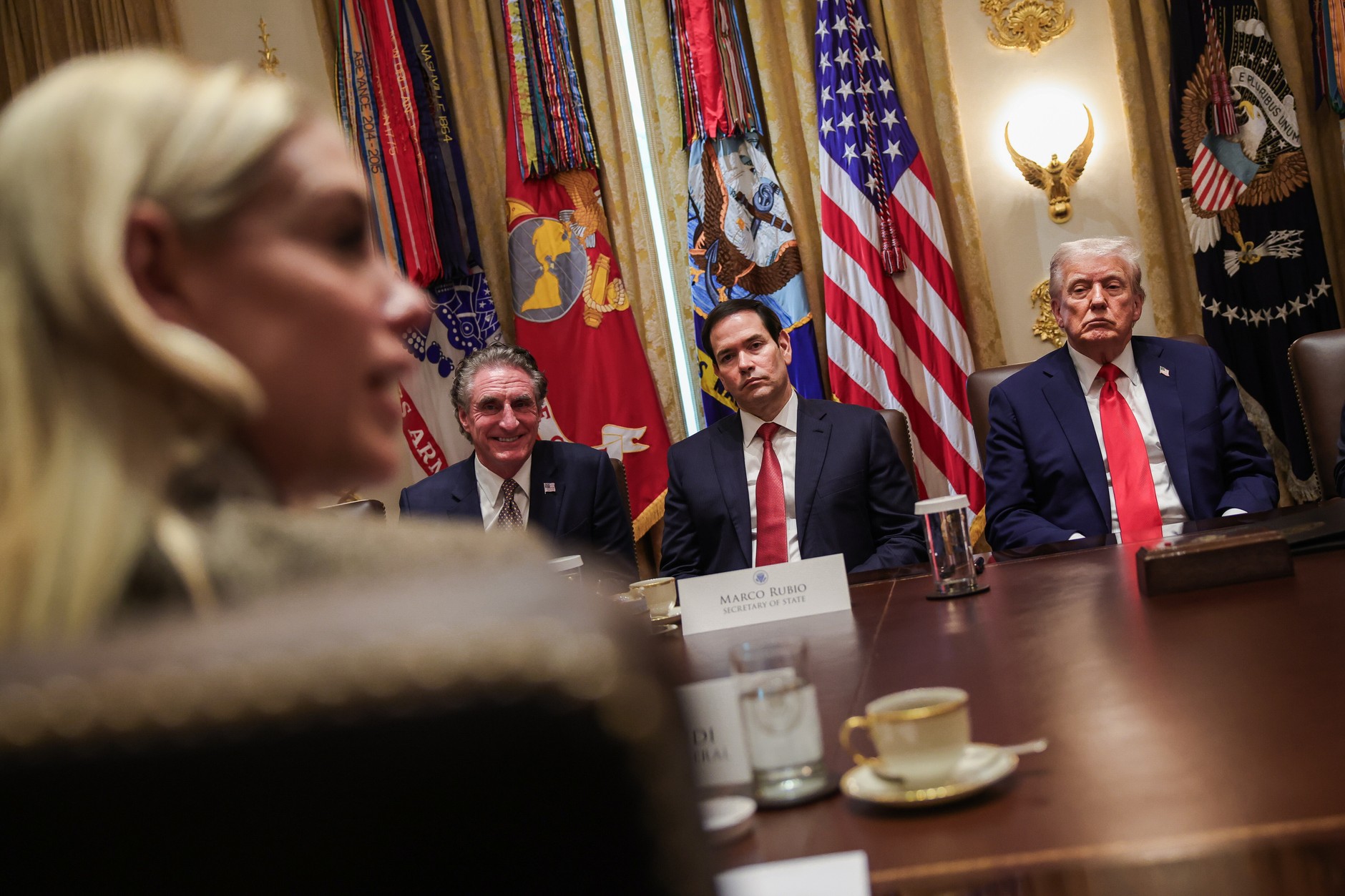 Pam Bondi speaks during a Cabinet meeting at the White House. Listening are Doug Burgum, Secretary of the Interior, Marco Rubio, Secretary of State, and President Donald Trump. Washington, October 9, 2025