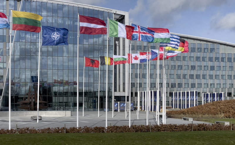 Several former NATO employees, targeted by corruption cases. Arrests and searches