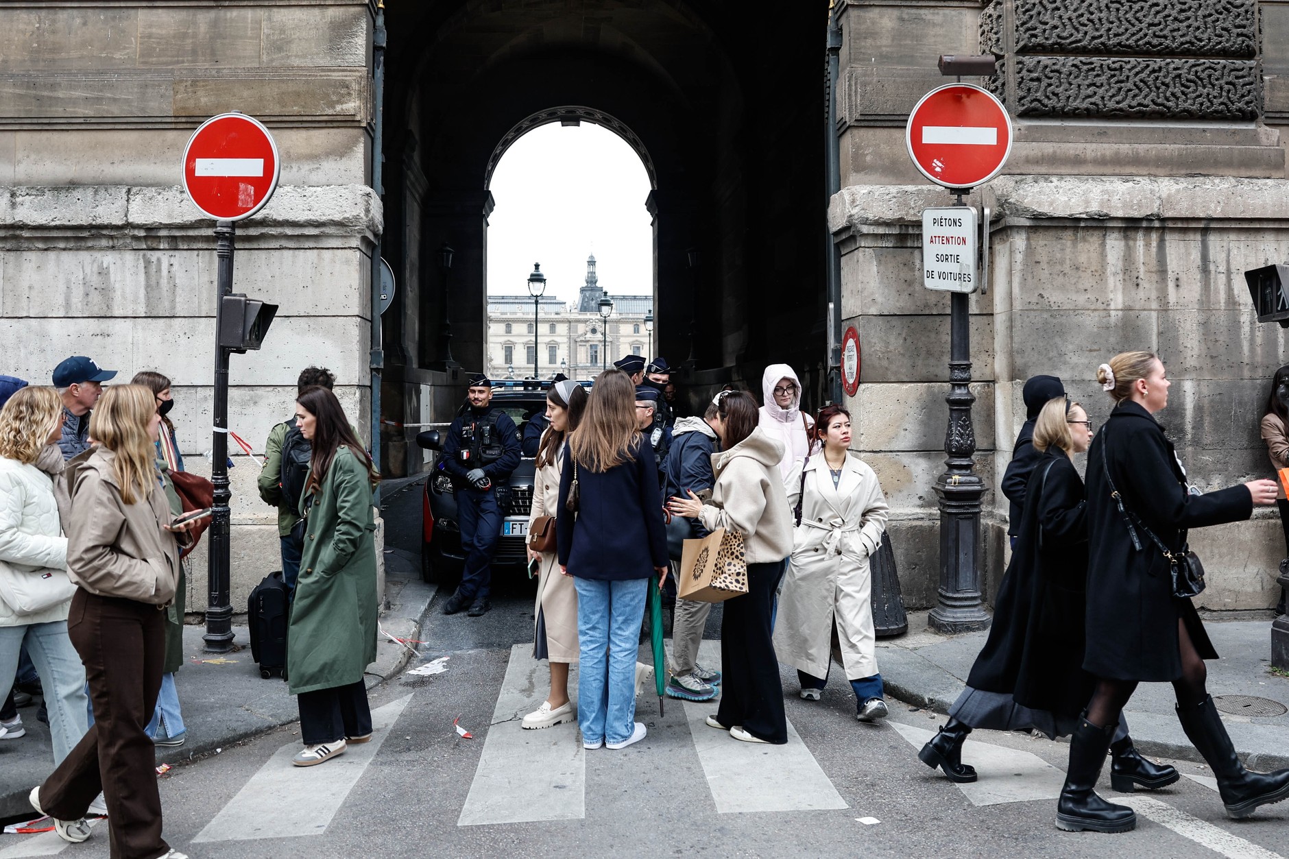 Police officers close the Place du Carrousel next to the Louvre after a robbery at the Louvre museum in Paris, France, October 19, 2025.