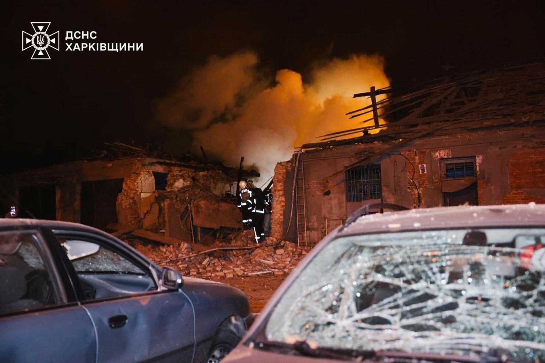 In this photo shared by Ukrainian emergency services, rescuers extinguish a fire at a hospital damaged by a Russian attack in Kharkov, October 14, 2025.