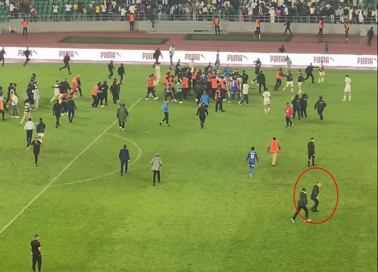Laurentiu Reghecampf, circled in red, in the chaos of Rwanda