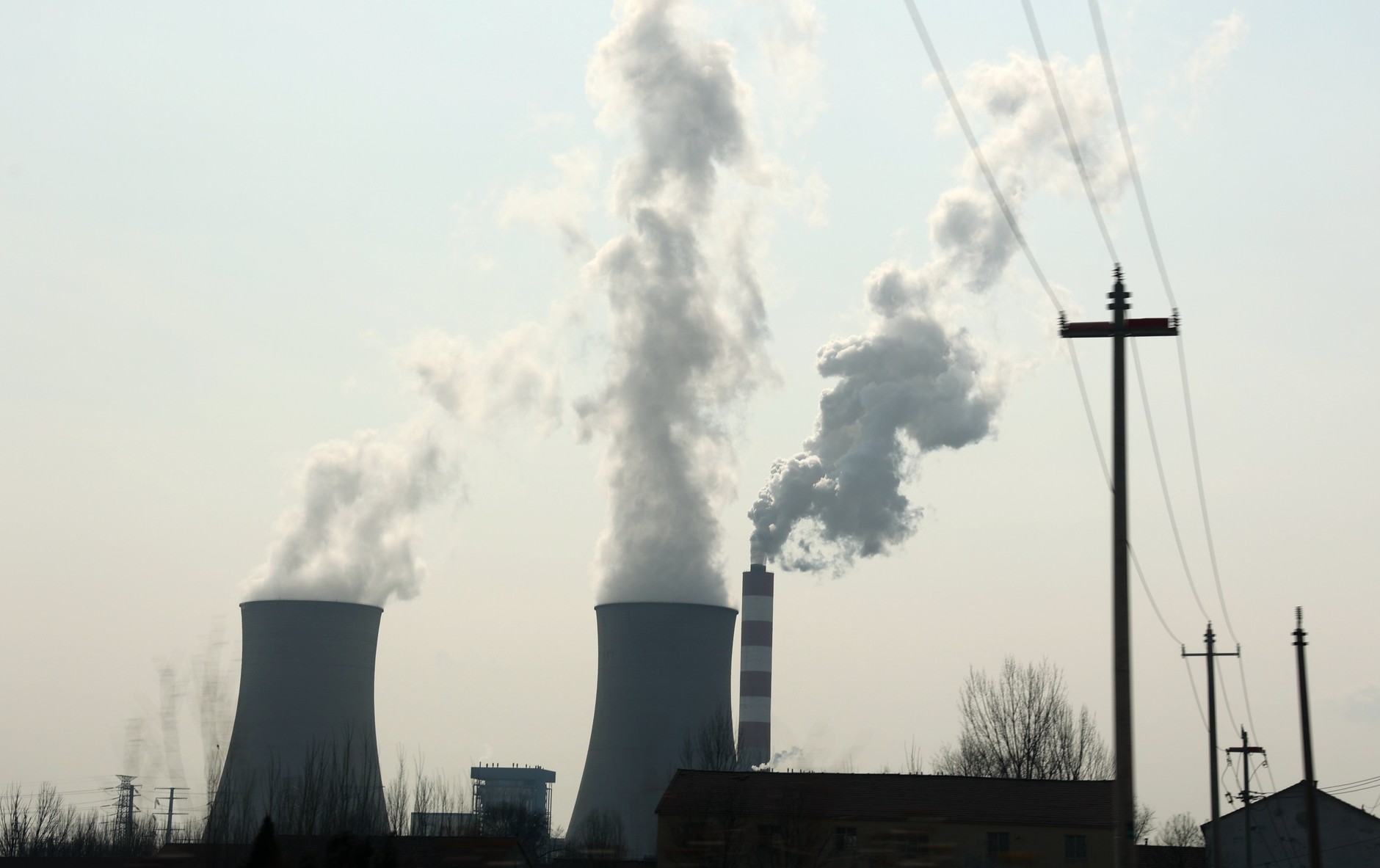 The power plant chimney emits purified exhaust gases. Binzhou, China, February 25, 2025