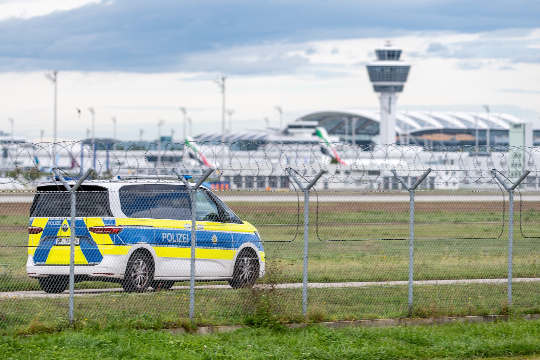 Police after the appearance of drones at the airport in Munich, Germany, October 4, 2025.