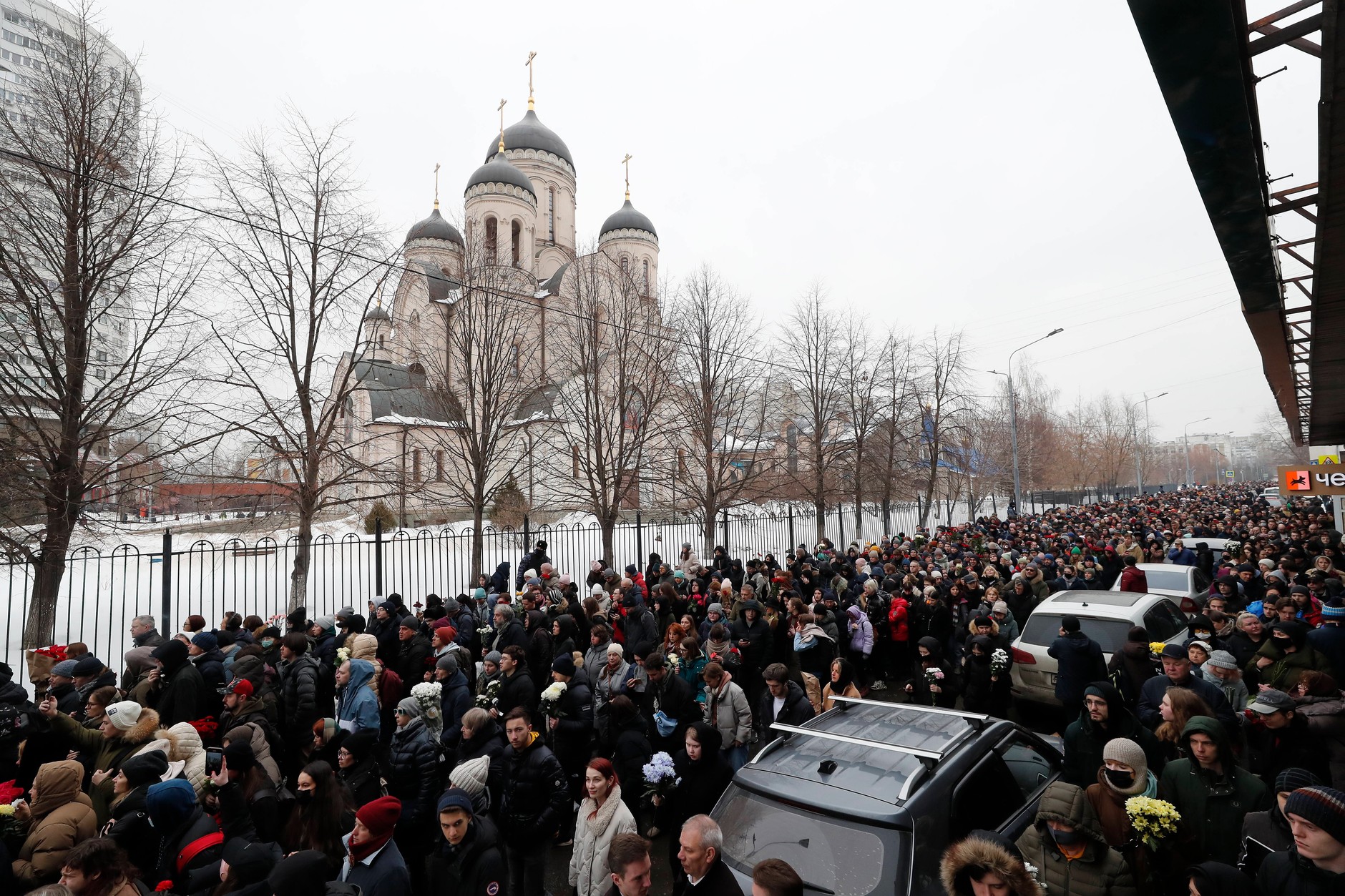 Crowds of Russians follow the hearse carrying the coffin of late Russian opposition leader Alexei Navalny outside the Church of the Icon of the Mother of God during his funeral in Moscow, Russia, March 1, 2024.