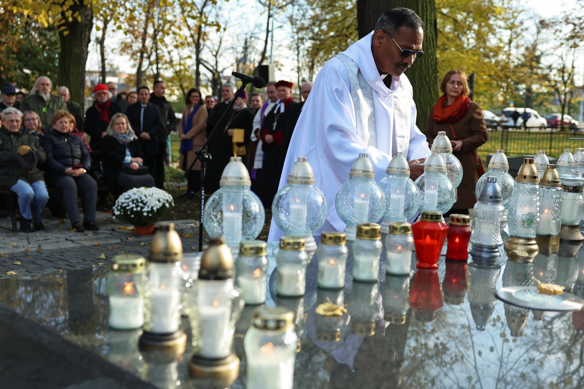 Pastor of the Anglican Church in Gdańsk Kasta Dip during an interdenominational prayer at the Cemetery of Defunct Cemeteries in Gdańsk