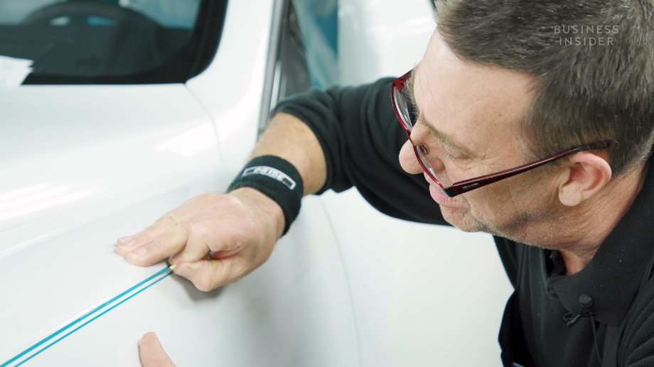 Detailed paint work on Rolls-Royce cars is done by hand by one person