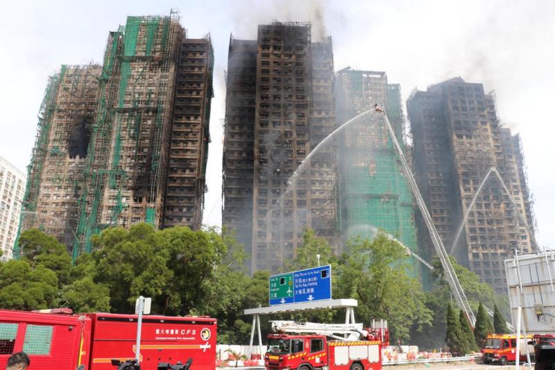 An old man trapped on the 31st floor of one of the burning buildings in Hong Kong for more than 24 hours has been brought out alive