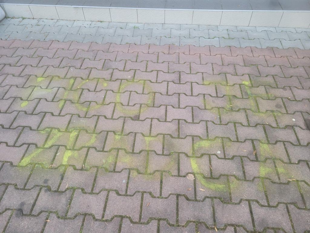 Writing "Fico is a traitor" sprayed on the sidewalk in front of a school in Poprad