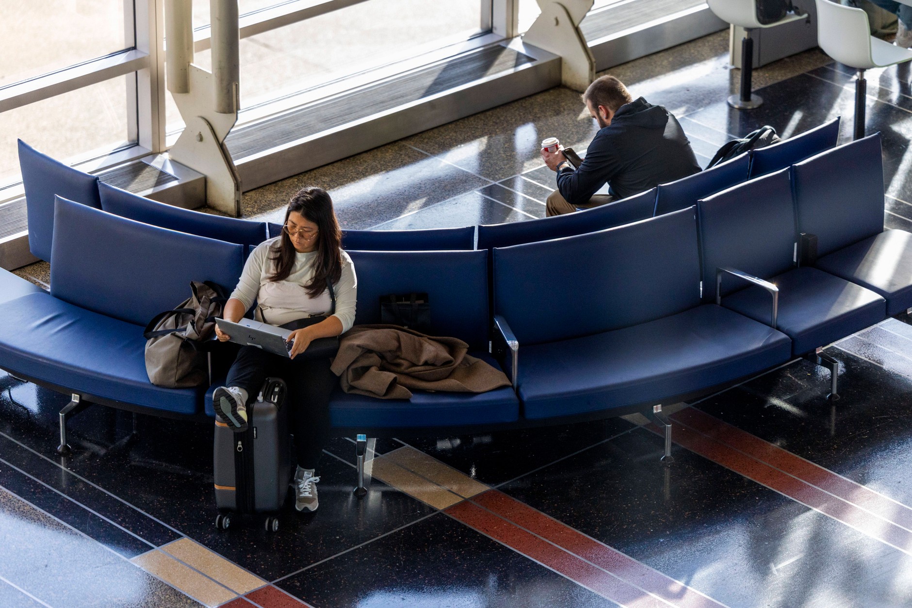 Passengers wait for their flights amid nationwide cancellations and delays at Ronald Reagan Arlington International Airport. USA, November 7, 2025
