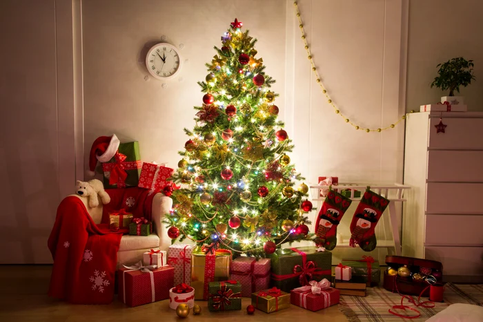 Beautifully decorated tree surrounded by gifts