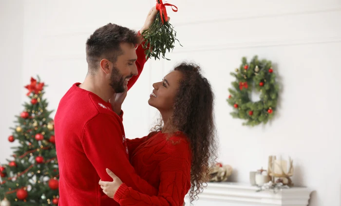 Kissing under the mistletoe brings luck and love. PHOTO: Shutterstock