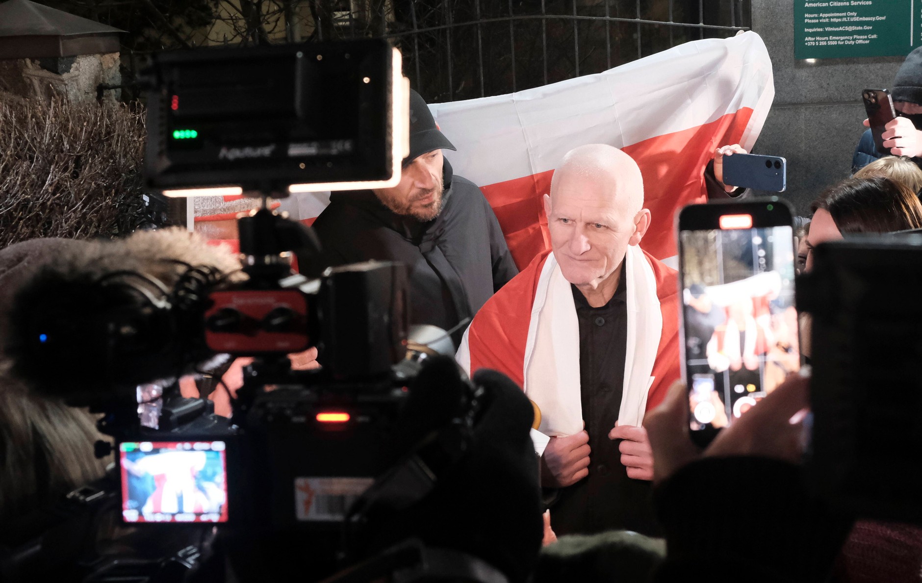 Ales Byalatsky (center) speaks to the media and his supporters in front of the U.S. Embassy in Vilnius, Lithuania (December 13, 2025)
