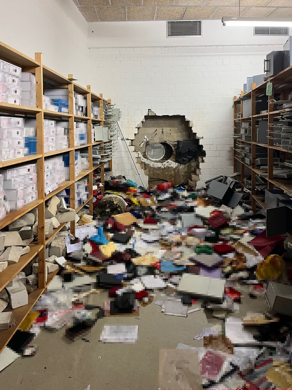 The thieves drilled a hole in the wall