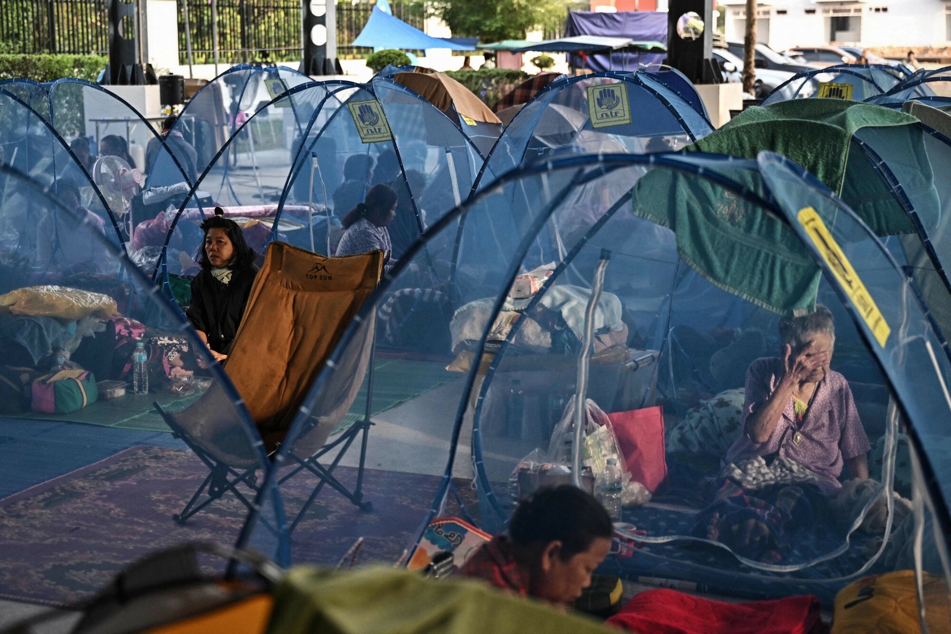 Evacuated residents rest in a refugee shelter, Sa Kaeo province, Thailand, December 10, 2025.