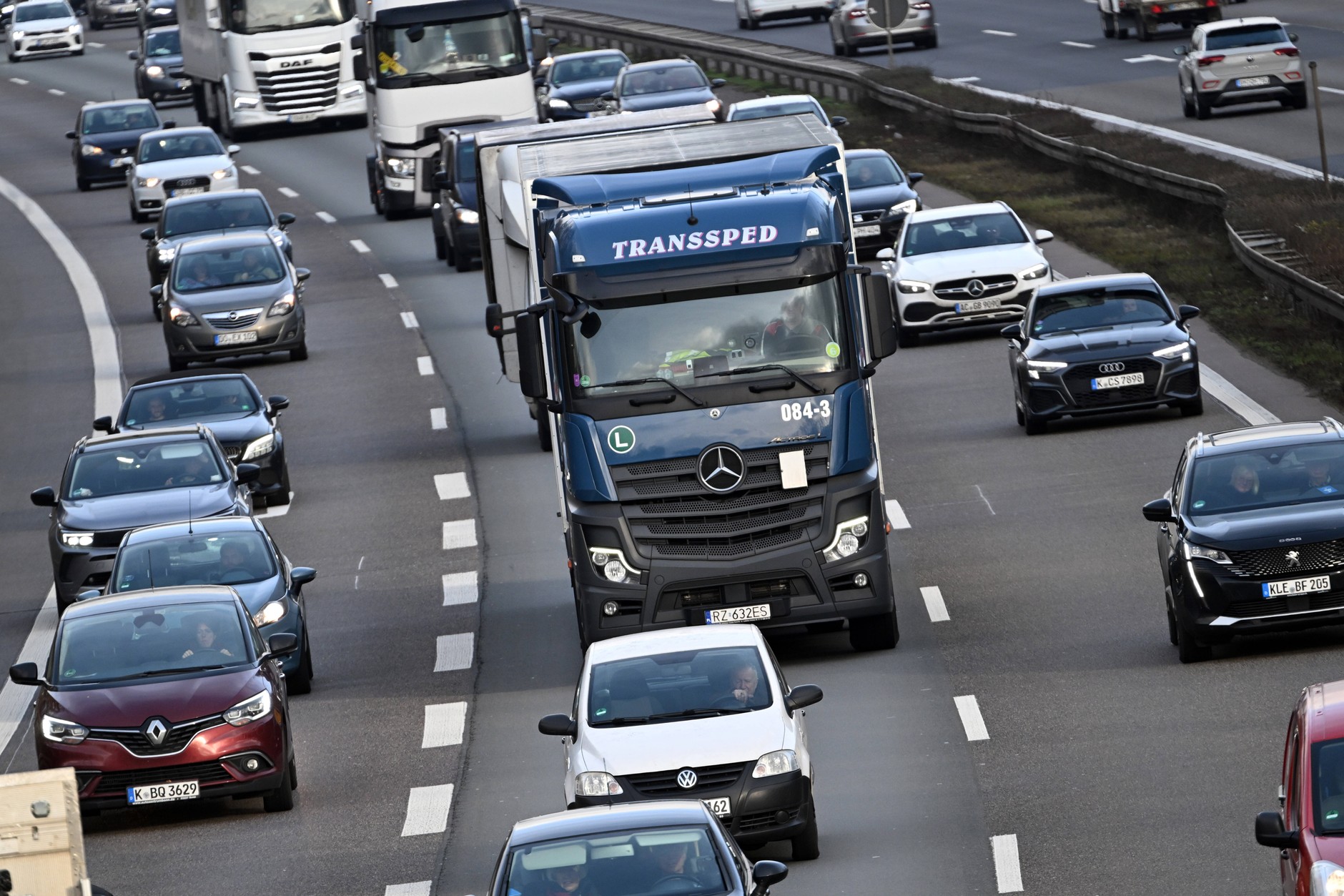Passenger cars and trucks on the German motorway A1, Cologne, Germany, December 24, 2024.