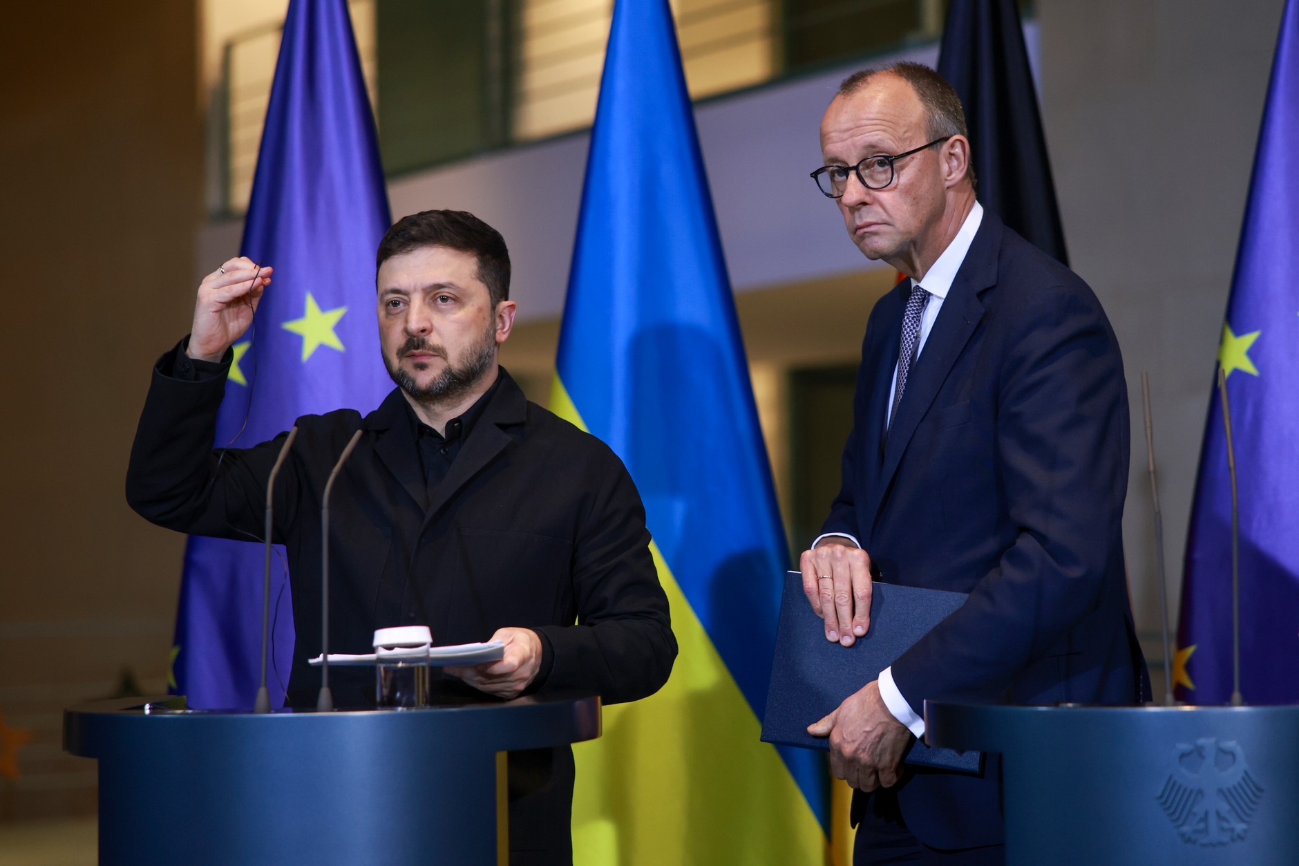 Ukrainian President Volodymyr Zelensky and German Chancellor Friedrich Merz attend a press conference at the Federal Chancellery in Berlin, Germany, December 15, 2025.
