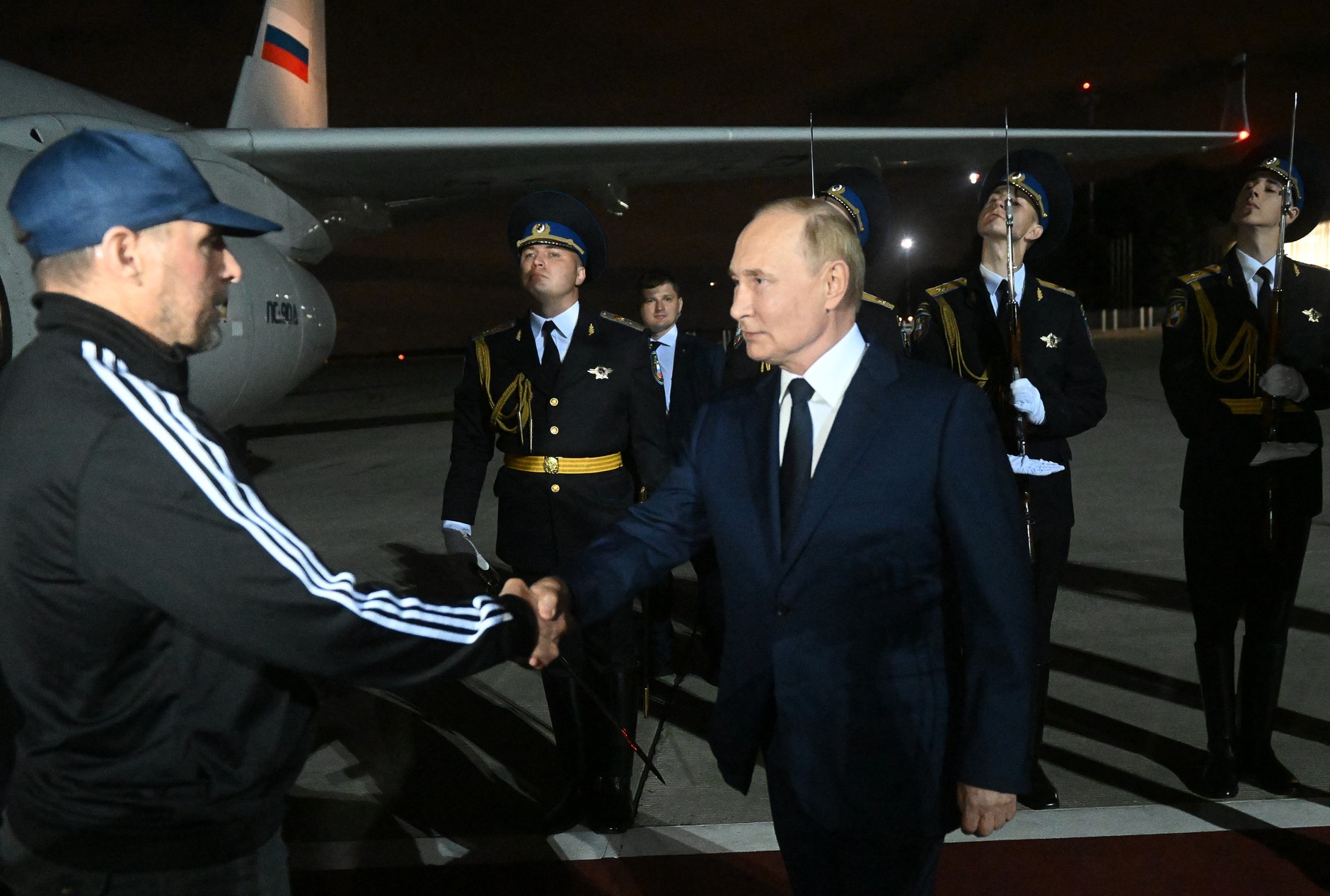 Russian President Vladimir Putin greets Vadim Krasikov, freed in a major prisoner exchange with the West, at Vnukovo airport, Moscow, Russia, August 1, 2024.