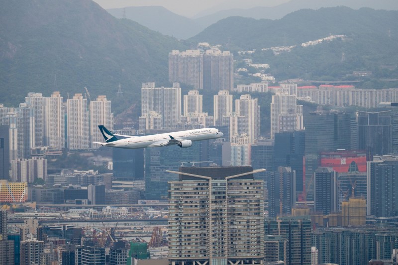 Passenger on plane that took off from US arrested after trying to open door during flight