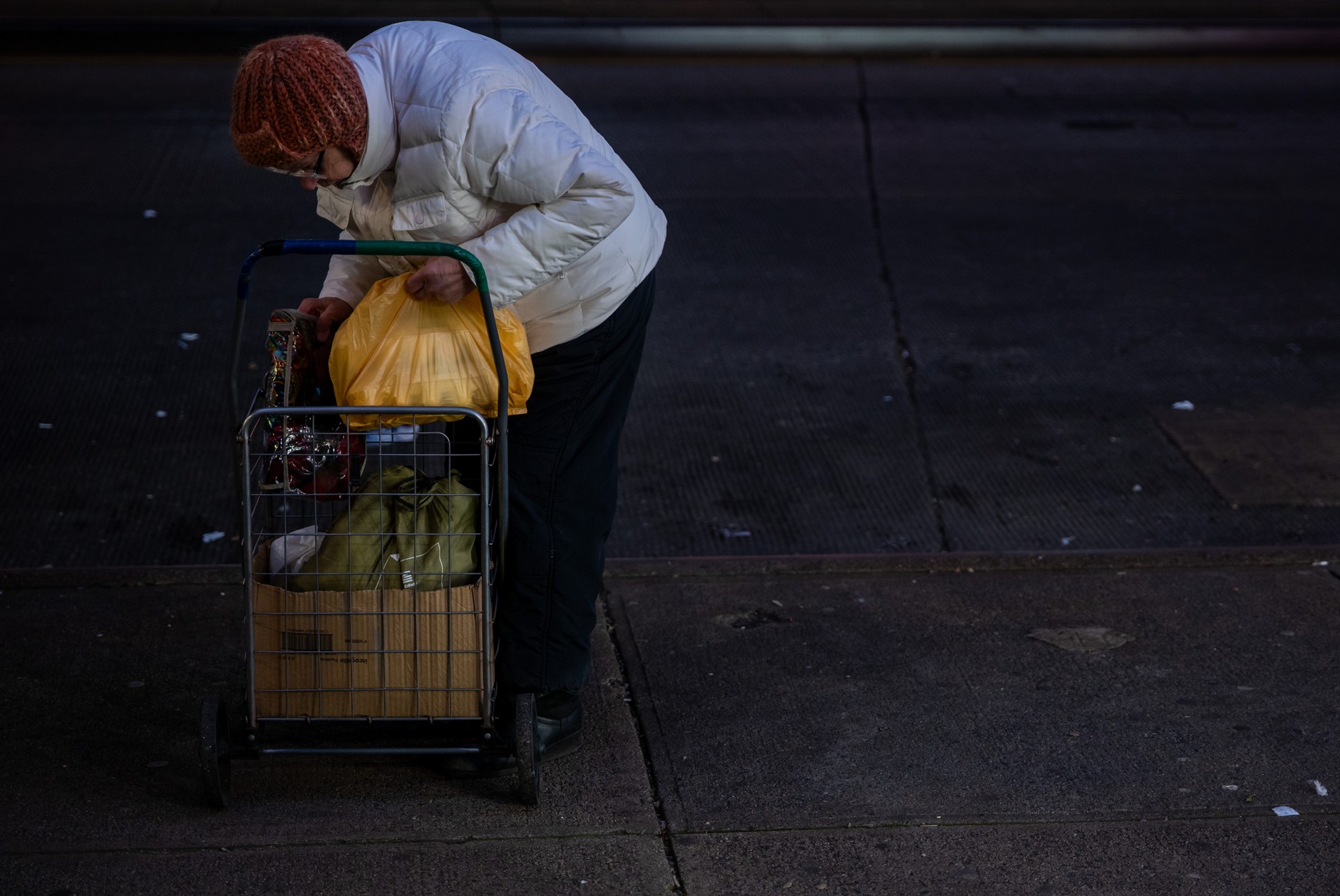 A New York resident returns from shopping, December 12, 2025.