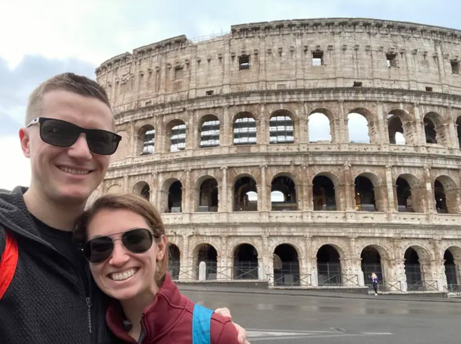 The couple enjoyed the view of the Colosseum in Rome with almost no one around