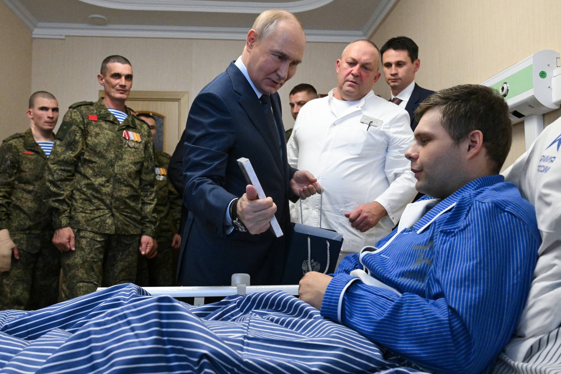 Vladimir Putin, president of Russia, visits soldiers at a military hospital in Moscow, October 29, 2025. 