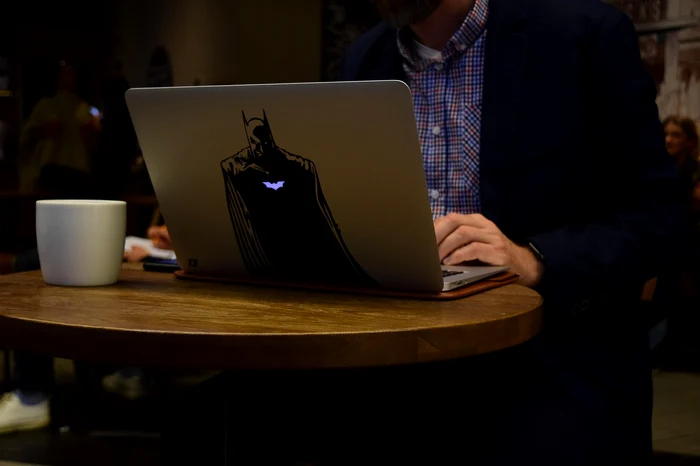 laptop with batman sticker