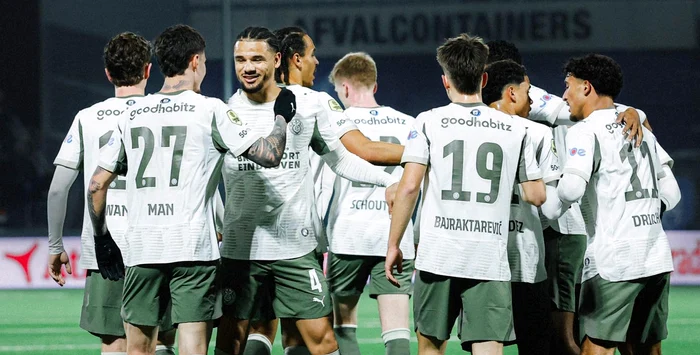 Dennis Man, congratulated by colleagues after the success. PSV Facebook photo