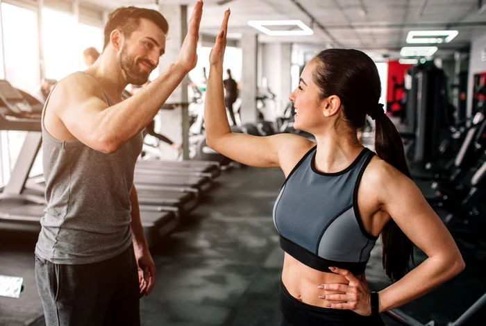 gym, woman and man clapping