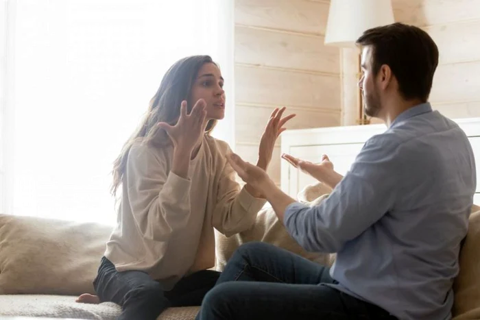 A couple is arguing, shouting in the apartment