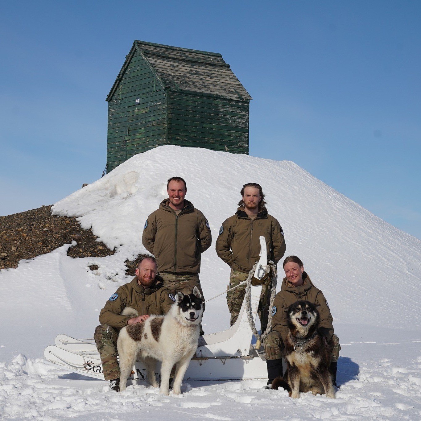 Station staff from mid-2025 accompanied by two sled dogs