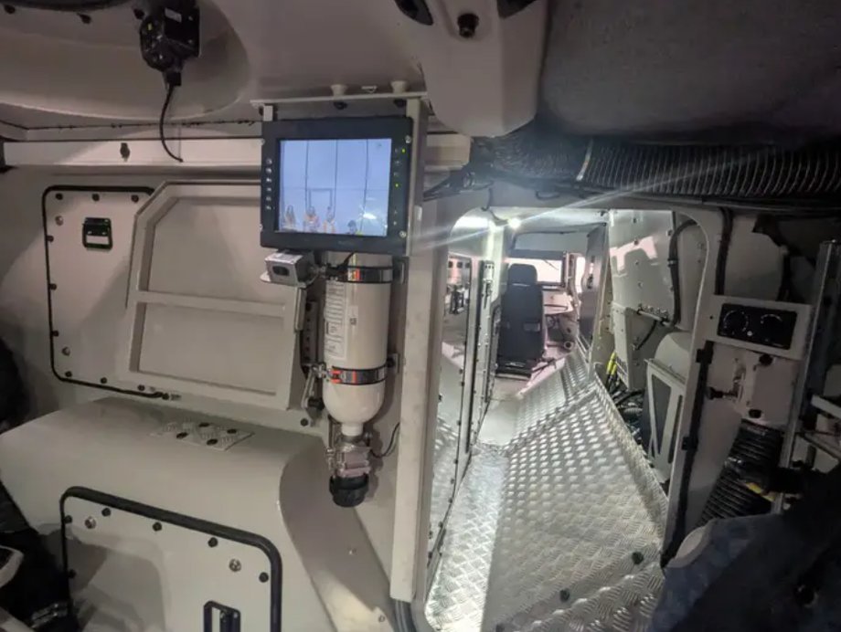 Screens in the 6x6 cabin show what is happening outside the vehicle. The passage leads to the driver's cabin