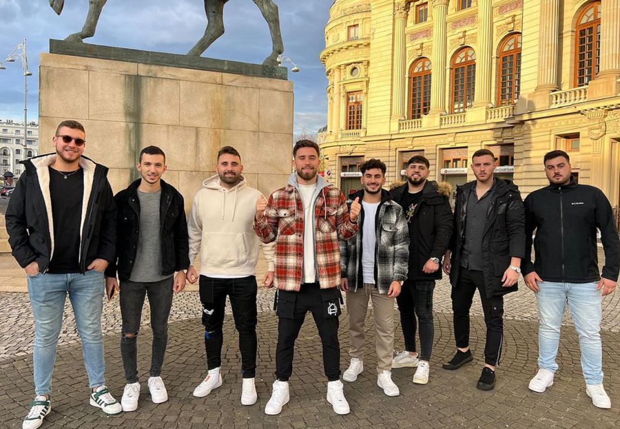 In the center of the image, in a red and white jacket, Ofri Arad, with friends, in Revolution Square Who is Ofri Arad? » The portrait of an atypical footballer and beyond the field