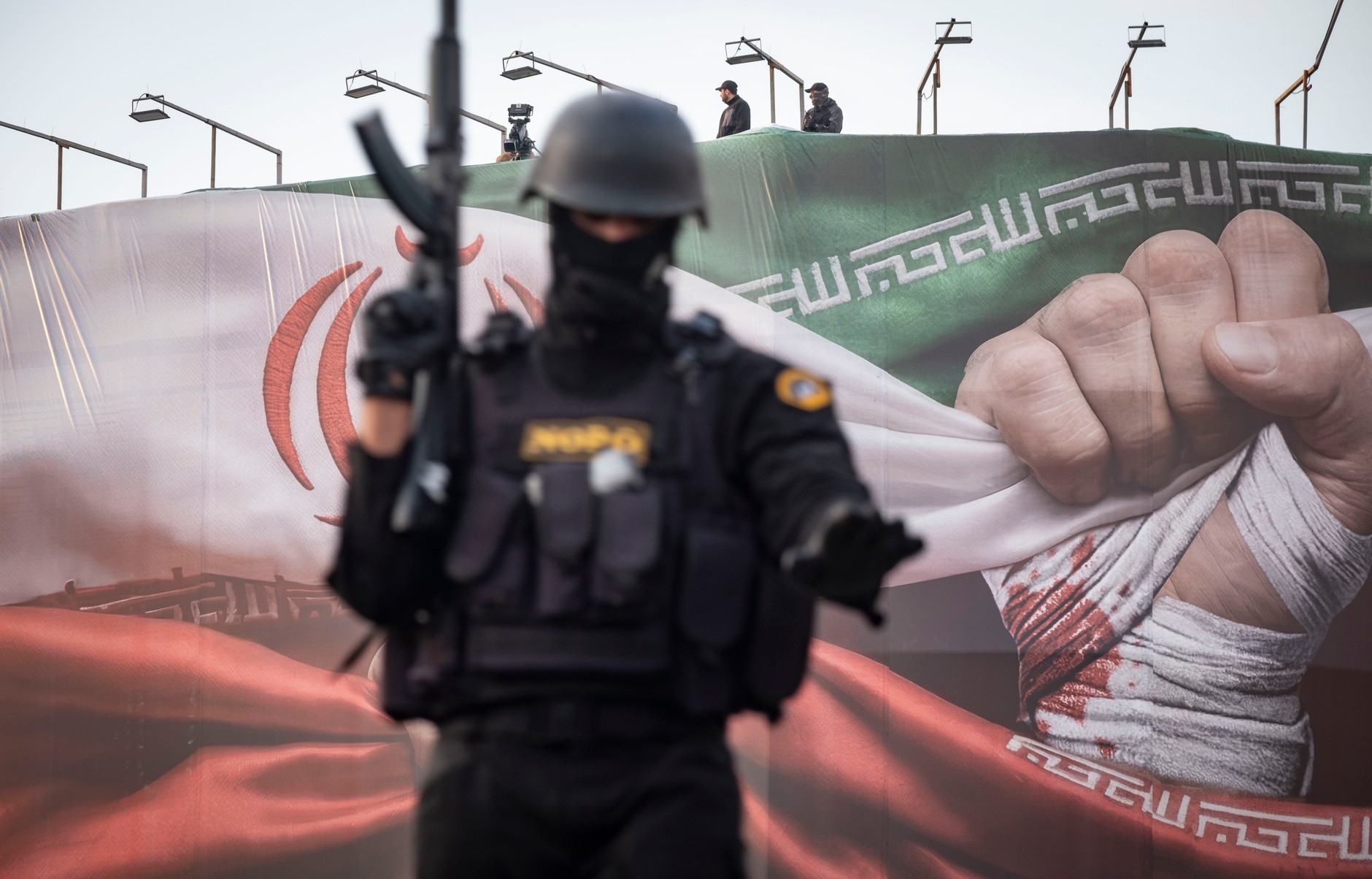 Armed members of Iran's special police forces monitor the area during a pro-government rally in central Tehran, January 12, 2026 (illustrative photo)