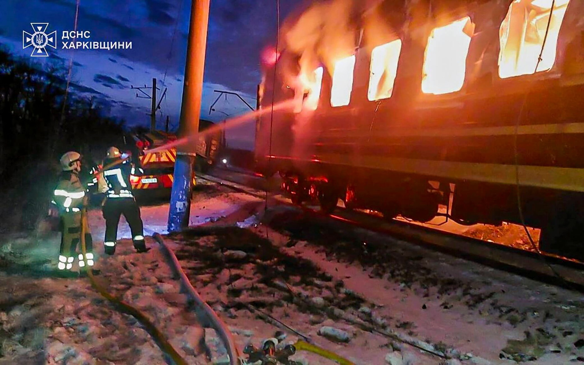 Ukrainian rescuers work at the scene of a Russian drone strike on a passenger train in the Kharkiv region of Ukraine, January 27, 2026.