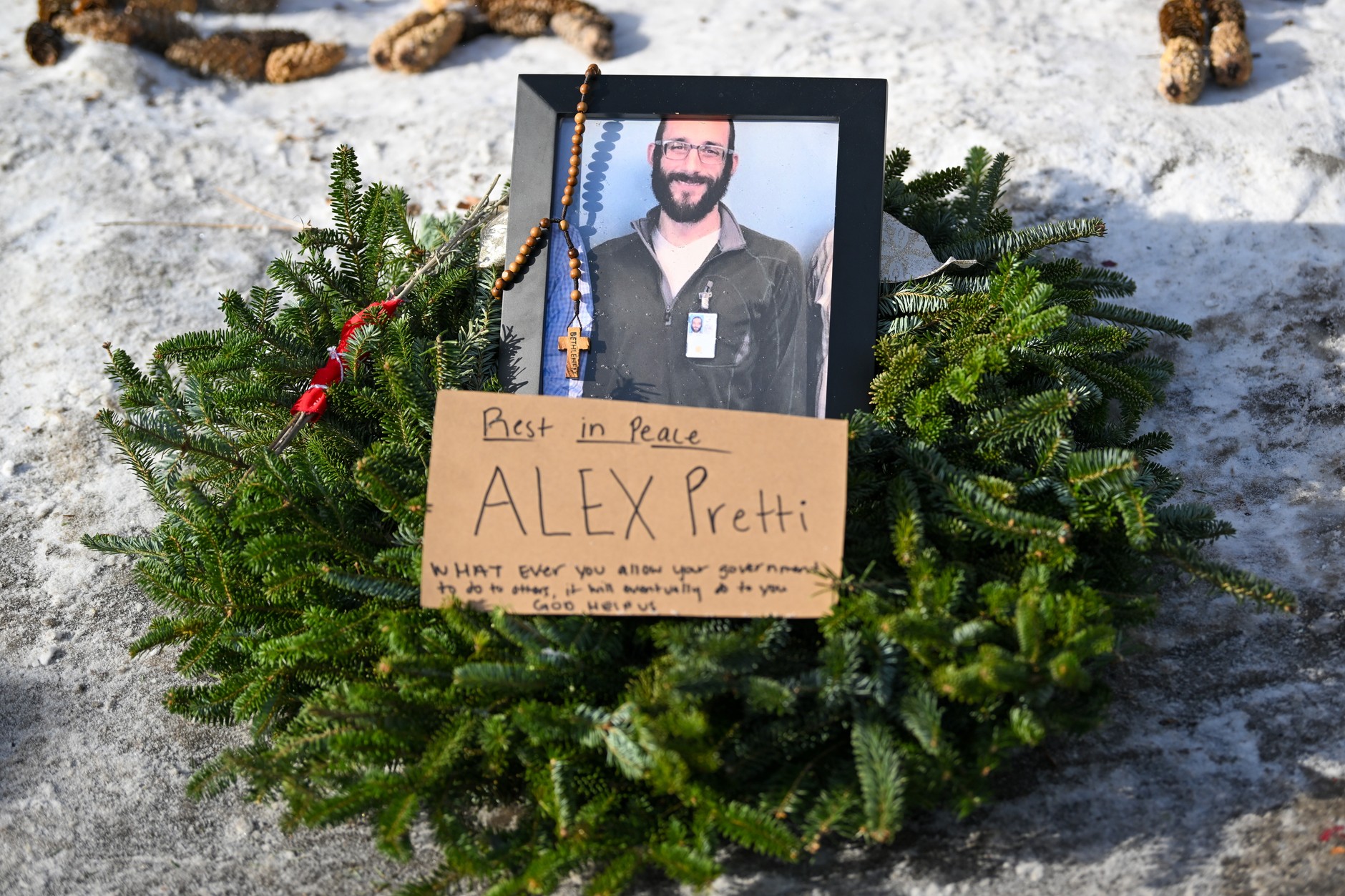 Flowers, candles and photos left at a makeshift memorial for Alex Pretti in south Minneapolis, Minnesota, U.S., January 25, 2026.