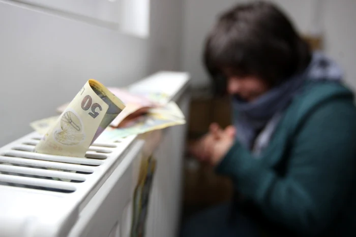 A young woman is chilling next to the cold radiator