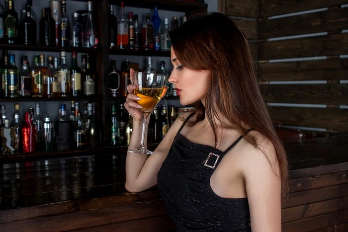 woman with glass of alcohol