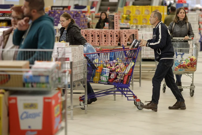 People shop in a supermarket in Bucharest. PHOTO: Inquam Photos
