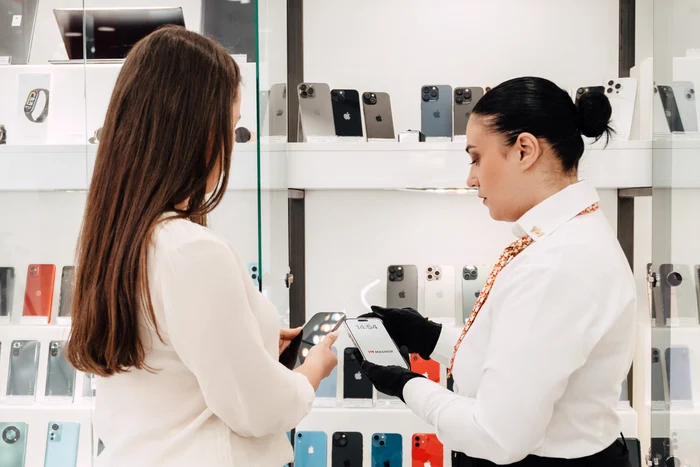 A woman buys a second-hand phone