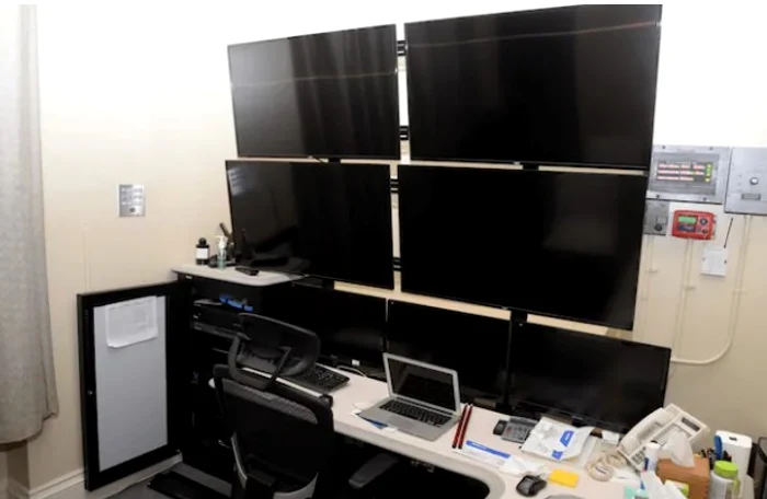 Media room in Epstein's New York home with superimposed screens. Source: Department of Justice