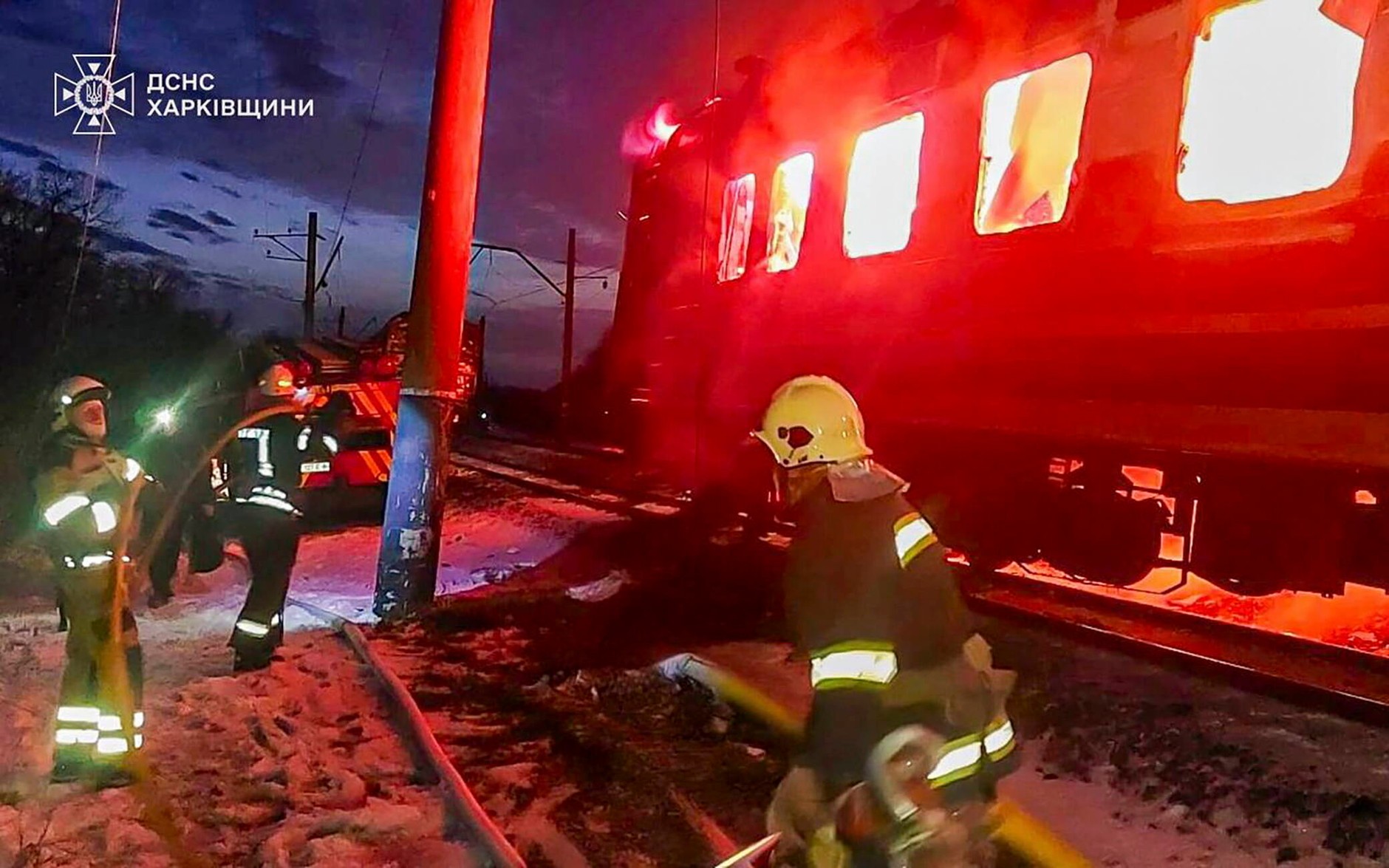 A passenger train burning as a result of a Russian drone attack in the Kharkiv Oblast, Ukraine, January 27, 2026.