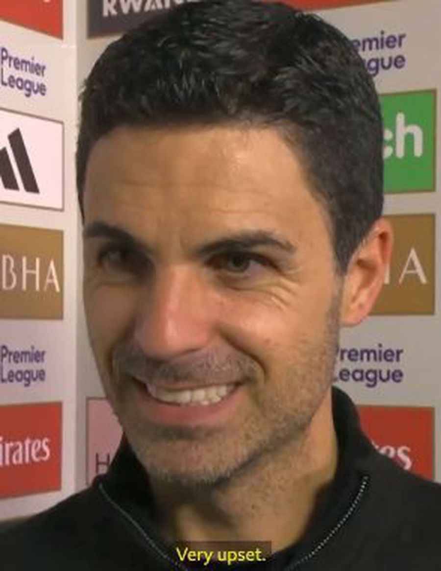 Mikel Arteta's expression when he answered the question With a big smile, Mikel Arteta laughed off Arsenal's naysayers: 'Yes, I'm very angry'